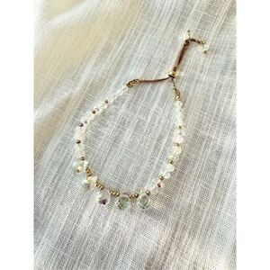 Iridescent beaded friendship bracelet with gold color